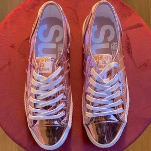 Metallic pink Superdry sneakers.